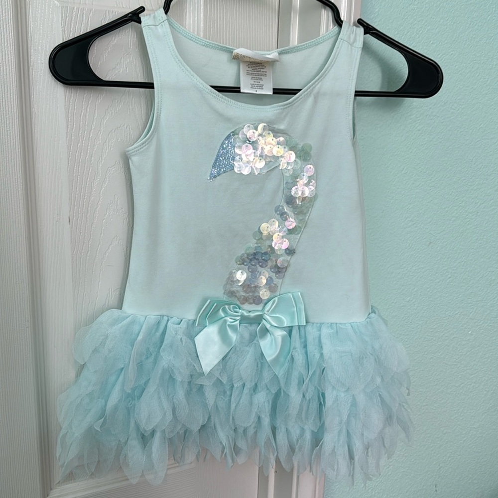 Ballet tutu. It’s worn and has a slight stain on it but not very noticeable